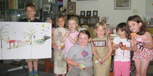 Younger members of Arty Crafty Kids Club showing off their work